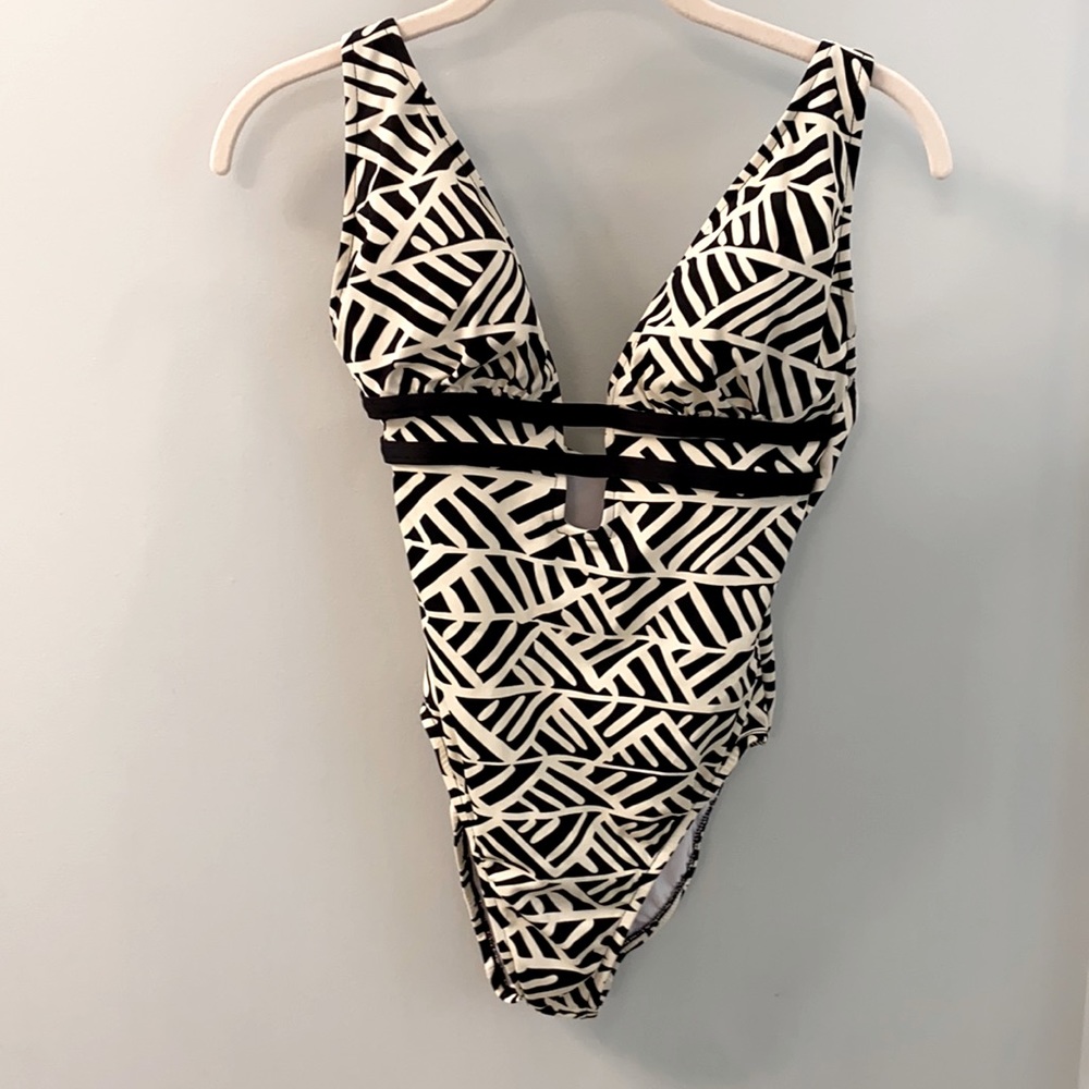 Women’s low cut one piece swimsuit- size M ( NWOT)